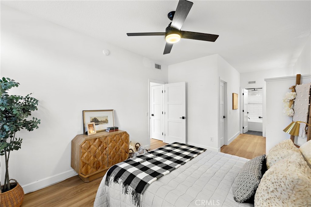 9 Violado Rancho Santa Margarita, CA 92688 - Photo 20 of 41 a bedroom with a bed and a chandelier