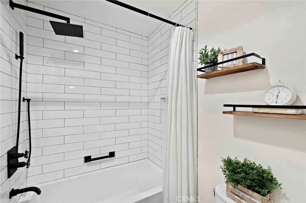 9 Violado Rancho Santa Margarita, CA 92688 - Photo 21 of 41 a bathroom with a shower and a sink