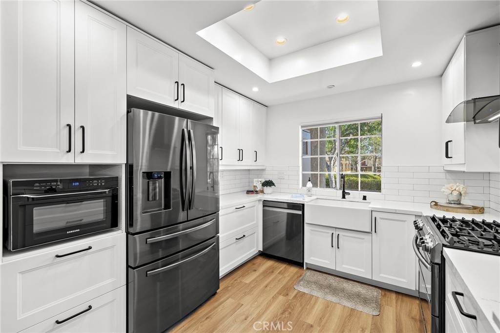9 Violado Rancho Santa Margarita, CA 92688 - Photo 5 of 41 a kitchen with a refrigerator stove and sink
