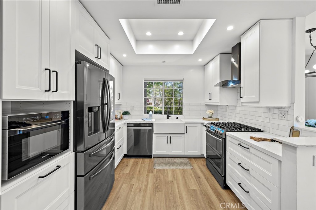 9 Violado Rancho Santa Margarita, CA 92688 - Photo 6 of 41 a kitchen with a sink stove and refrigerator