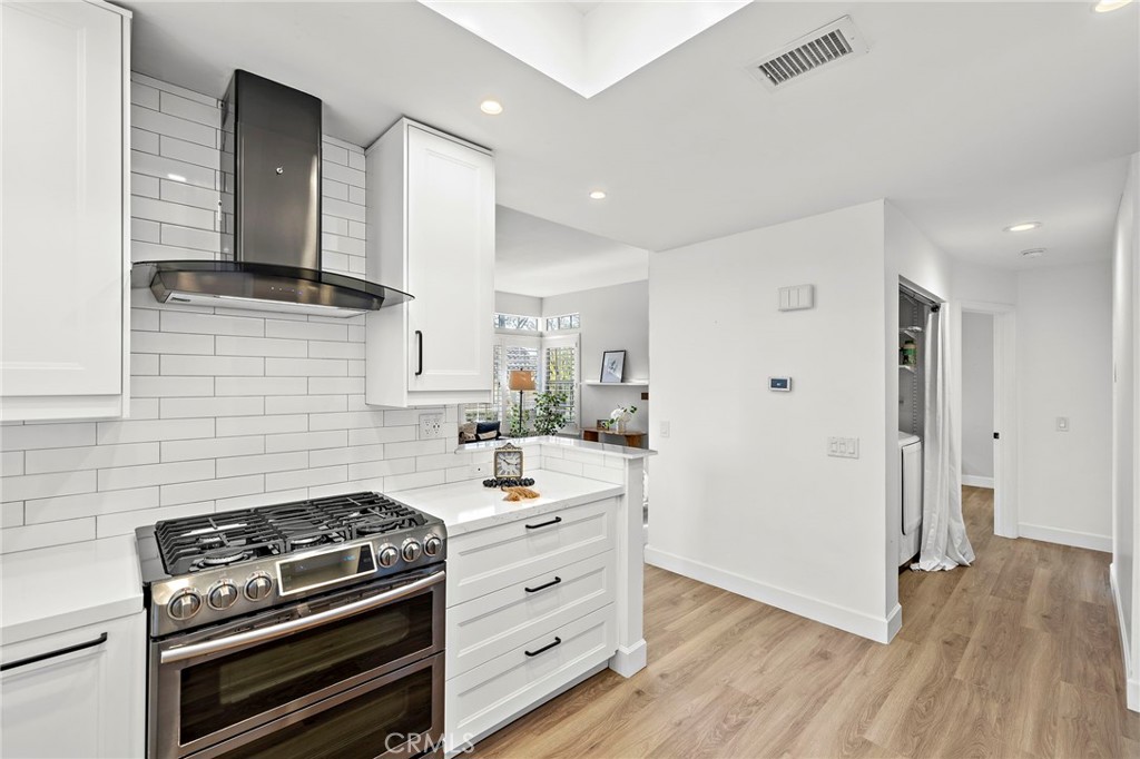 9 Violado Rancho Santa Margarita, CA 92688 - Photo 7 of 41 a kitchen with a stove and a refrigerator