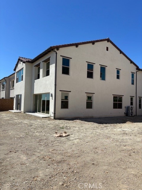 104 Sunnybank Irvine, CA 92618 - Photo 3 of 5 a house with trees in front of it