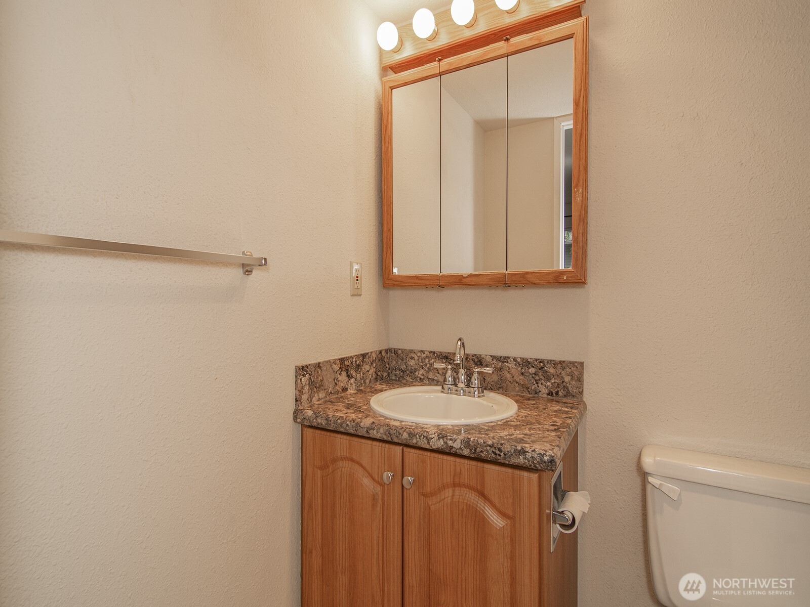 14527 Northeast 40th Street, Unit G204 Bellevue, WA 98007 - Photo 11 of 17 a bathroom with a sink and a mirror