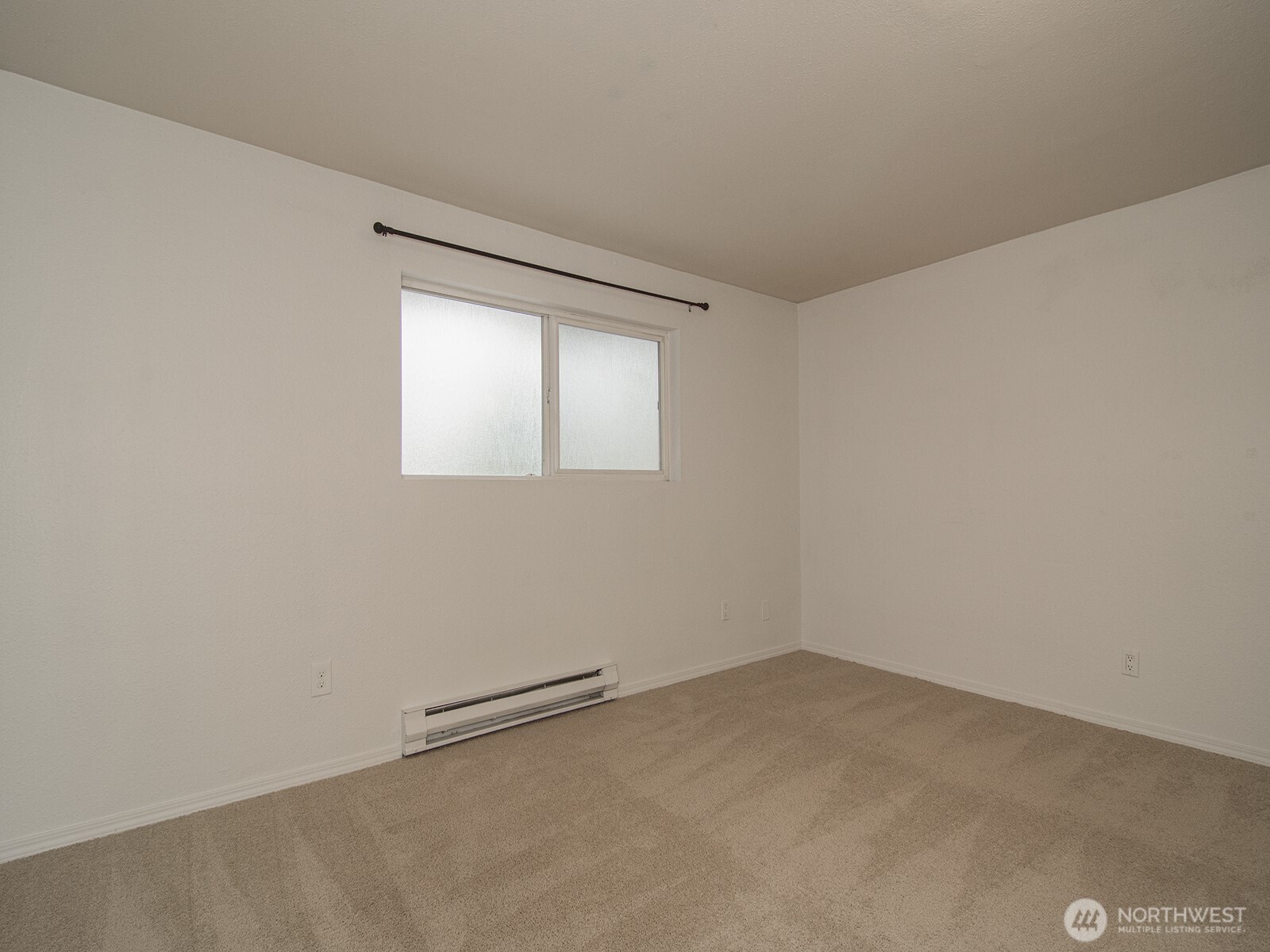 14527 Northeast 40th Street, Unit G204 Bellevue, WA 98007 - Photo 12 of 17 an empty room with a empty space and window