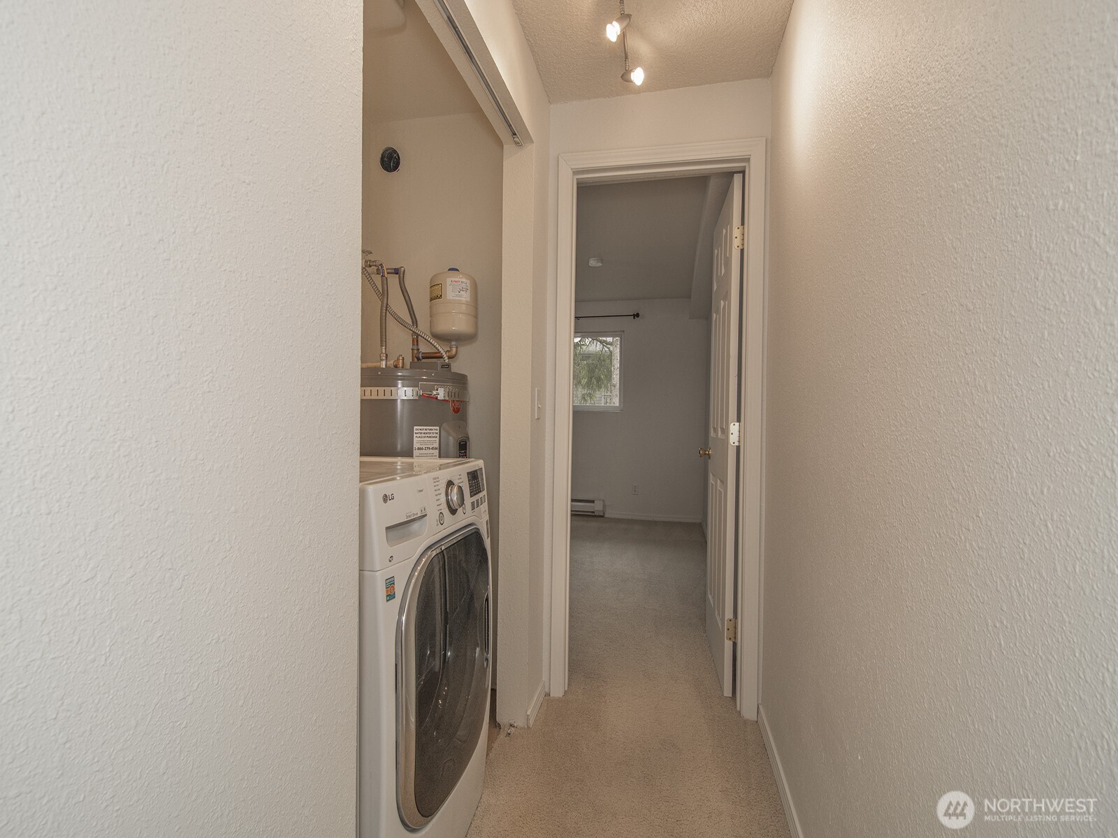 14527 Northeast 40th Street, Unit G204 Bellevue, WA 98007 - Photo 14 of 17 a view of a bathroom with washing machine