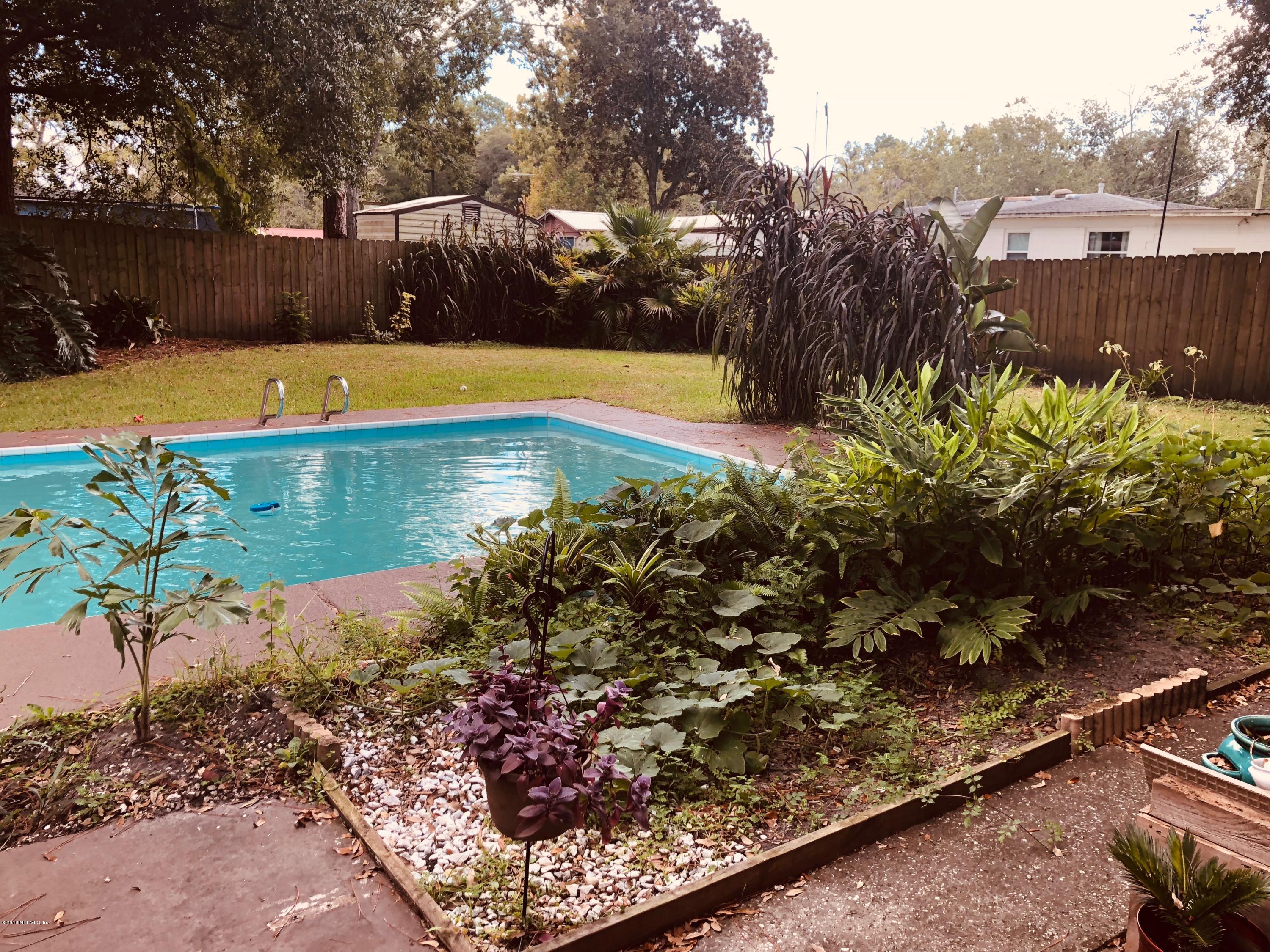 5461 Cardan Road Jacksonville, FL 32244 - Photo 6 of 8 a view of a yard with an umbrella