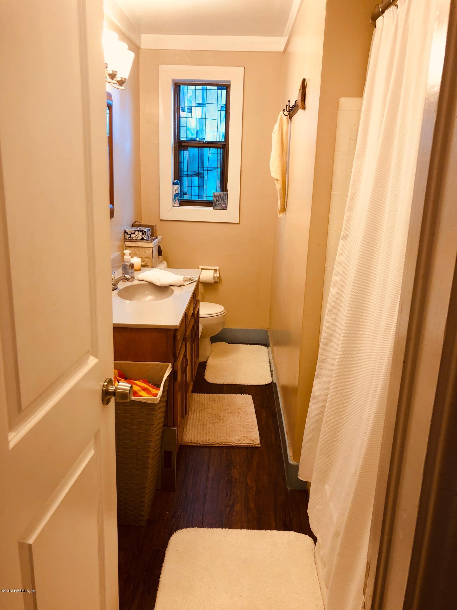 5461 Cardan Road Jacksonville, FL 32244 - Photo 8 of 8 a bathroom with a sink and a mirror