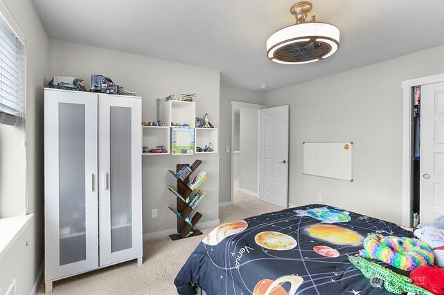 1325 Seattle Hill Road, Unit C2 Bothell, WA 98012 - Photo 14 of 26 a bedroom with furniture and a bed