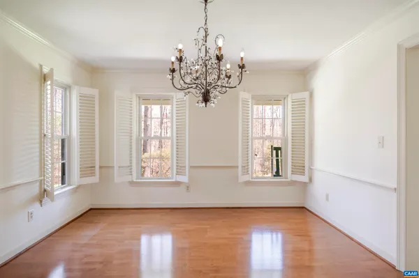 a view of hallway with wooden floor