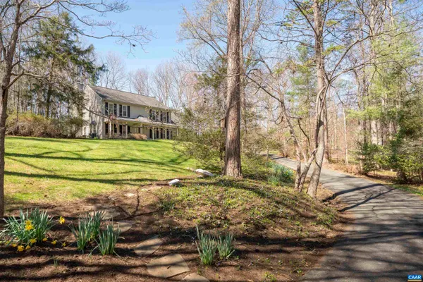 a front view of house with yard and seating space
