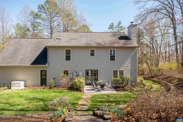 an empty room with cabinet and windows
