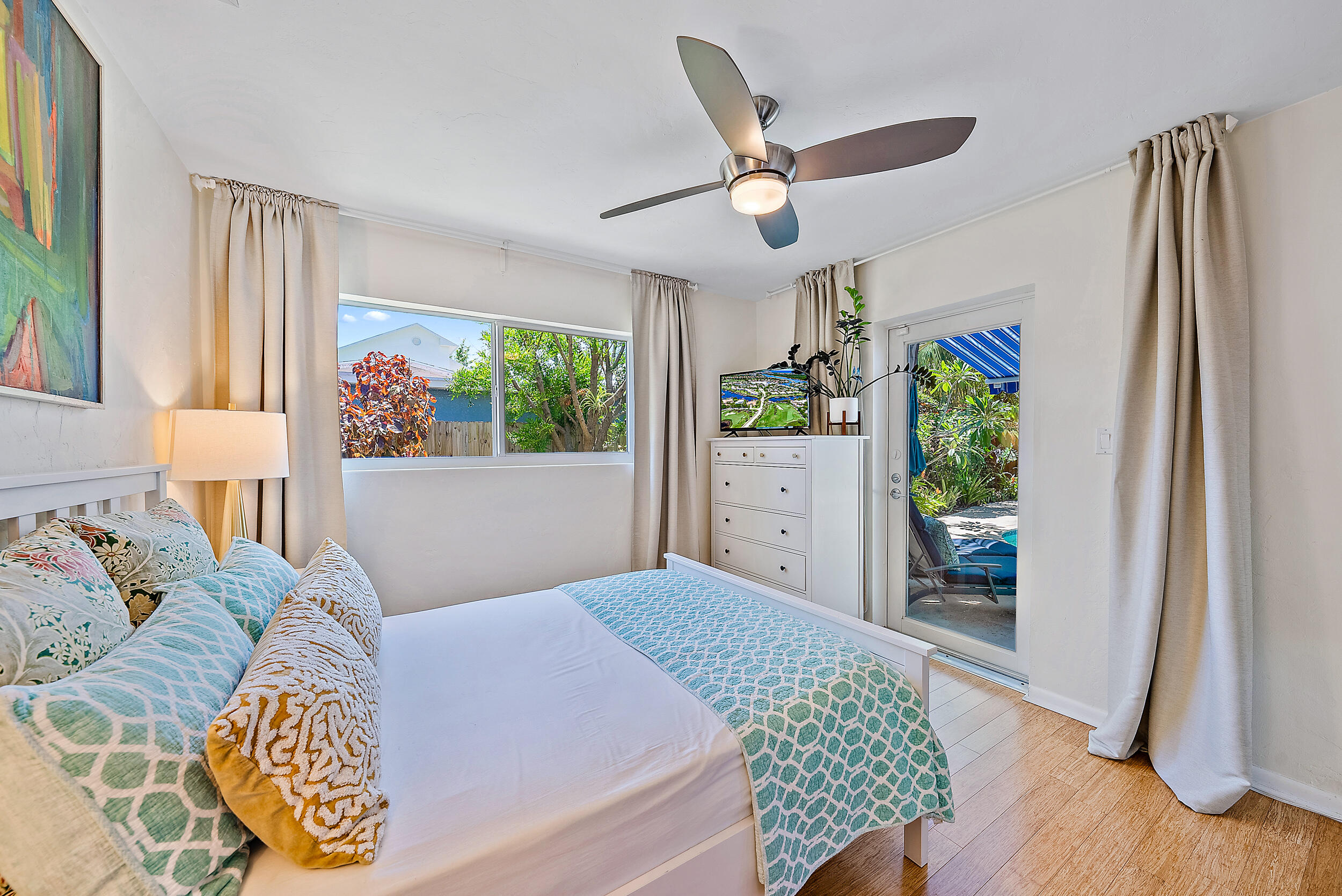 246 Gregory Road West Palm Beach, FL 33405 - Photo 13 of 20 a bedroom with a bed dresser and a window