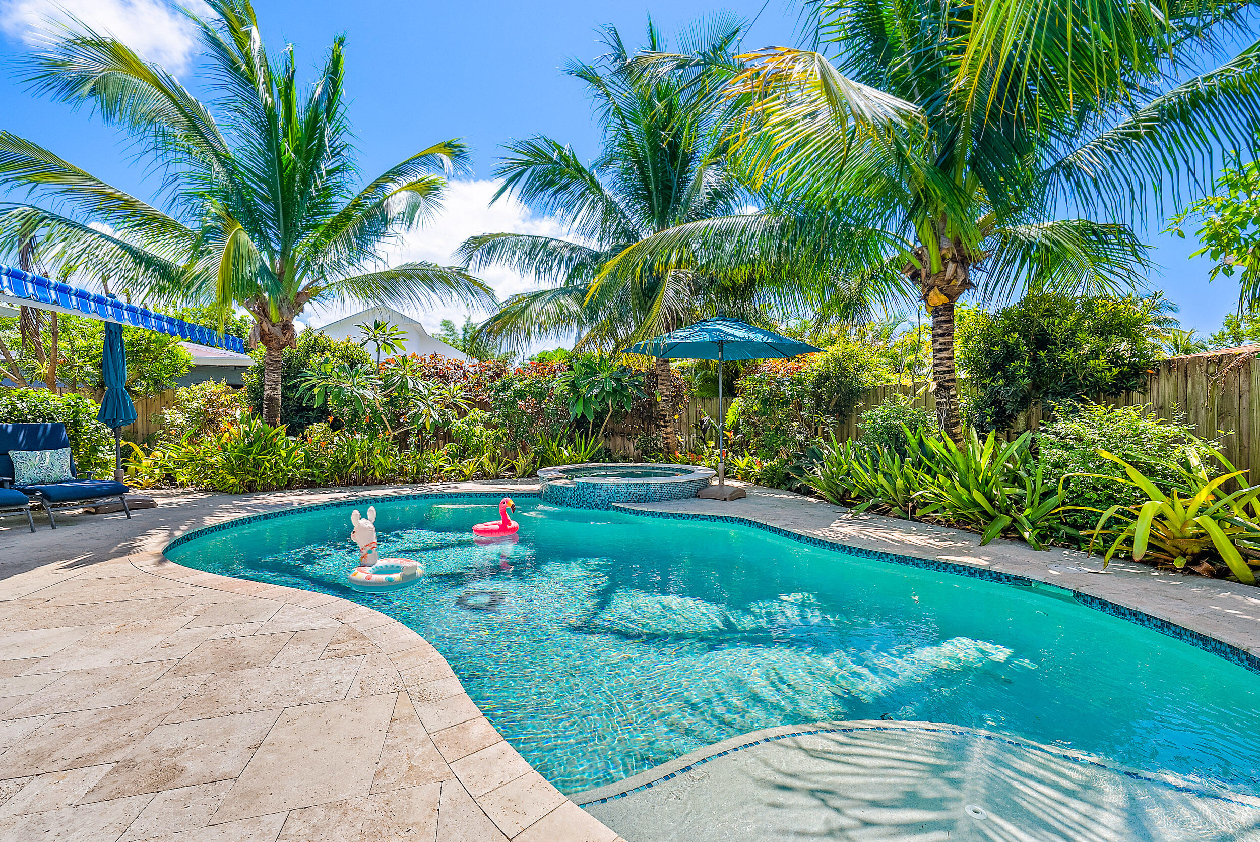 246 Gregory Road West Palm Beach, FL 33405 - Photo 16 of 20 a view of green field with flowers