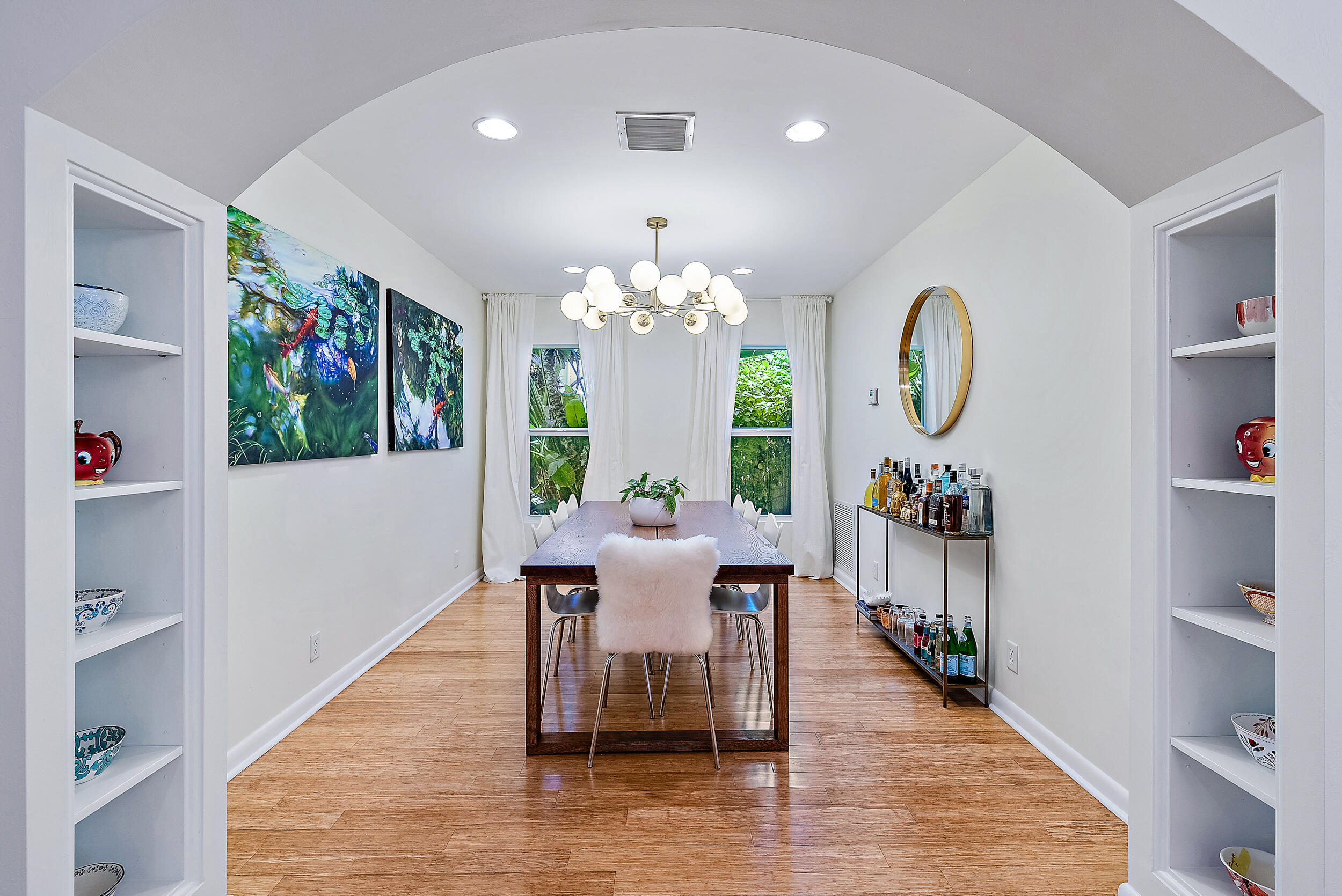 246 Gregory Road West Palm Beach, FL 33405 - Photo 8 of 20 a view of a dining room with furniture a chandelier and wooden floor