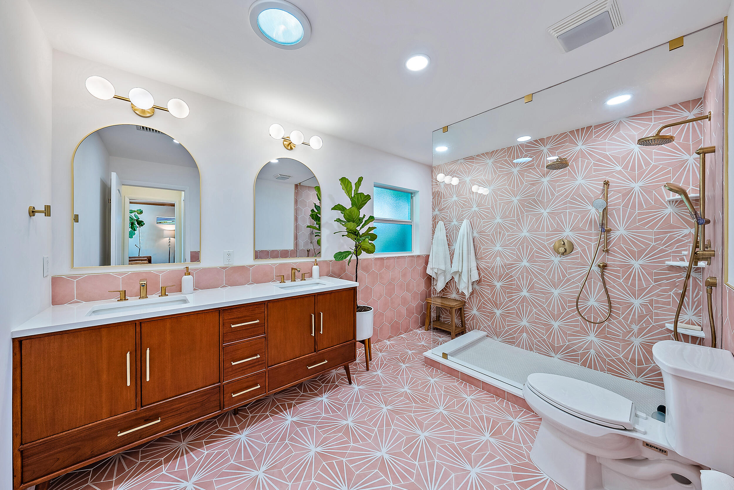 246 Gregory Road West Palm Beach, FL 33405 - Photo 10 of 20 a spacious bathroom with a double vanity sink toilet mirror and bathtub