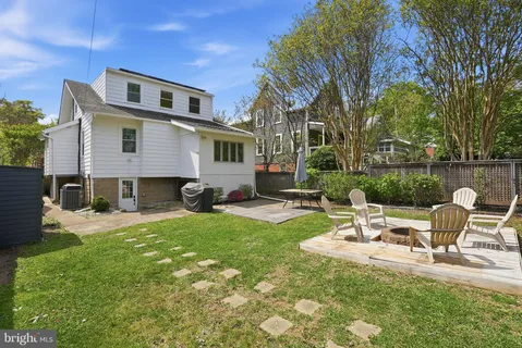 a house view with a sitting space and garden