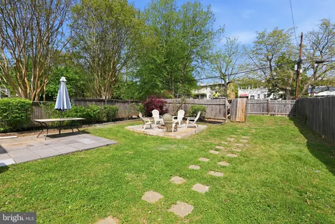 a view of a backyard with sitting area