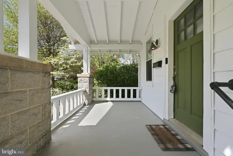 a view of a balcony with wooden floor