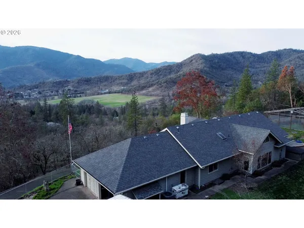 a aerial view of a house in a yard