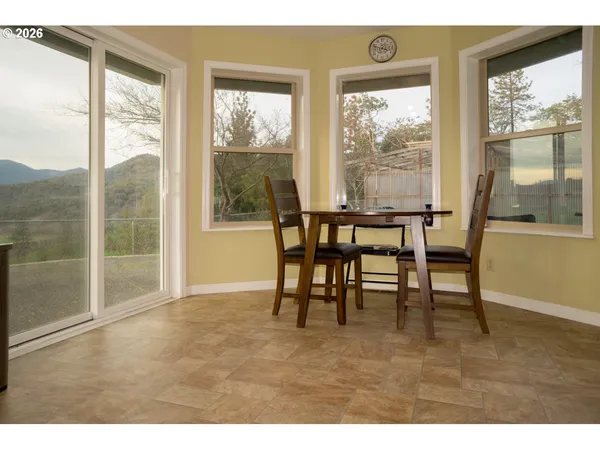 a view of a room with furniture and windows
