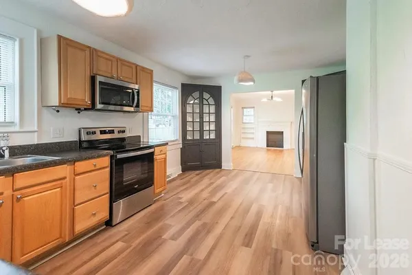 a kitchen with a sink and a window