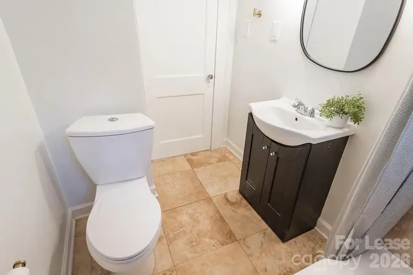 a bathroom with a tub toilet and sink