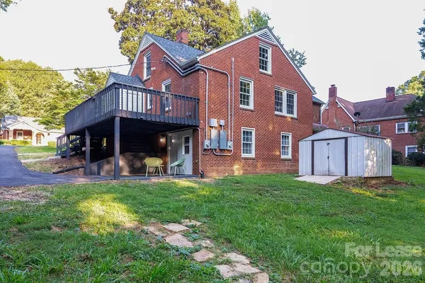 a view of a house with a yard porch and sitting area