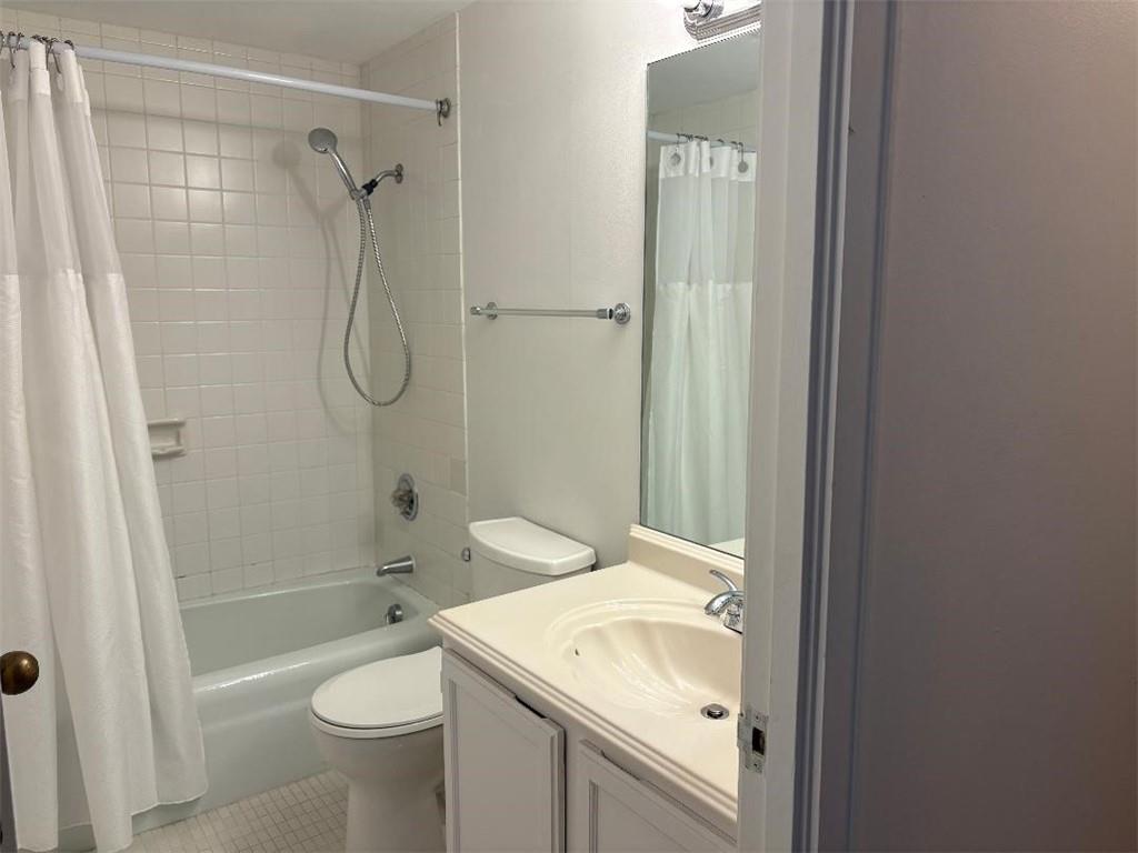 145 15th Street Northeast, Unit 1007 Atlanta, GA 30361 - Photo 12 of 14 a bathroom with a sink a toilet and shower
