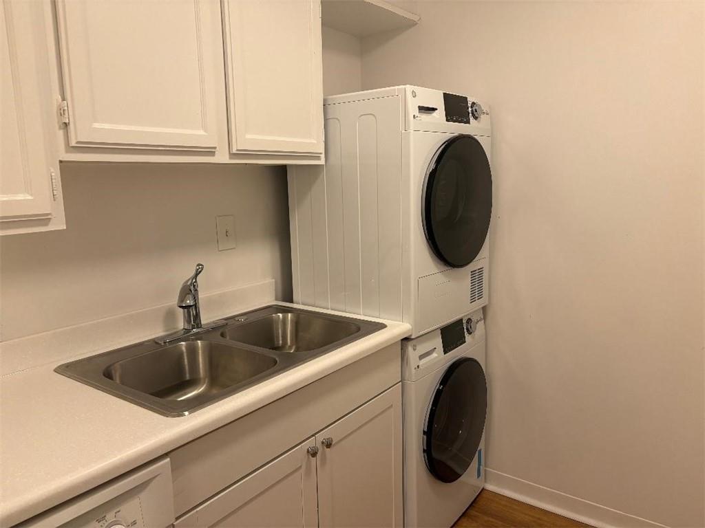 145 15th Street Northeast, Unit 1007 Atlanta, GA 30361 - Photo 14 of 14 a utility room with sink dryer and washer