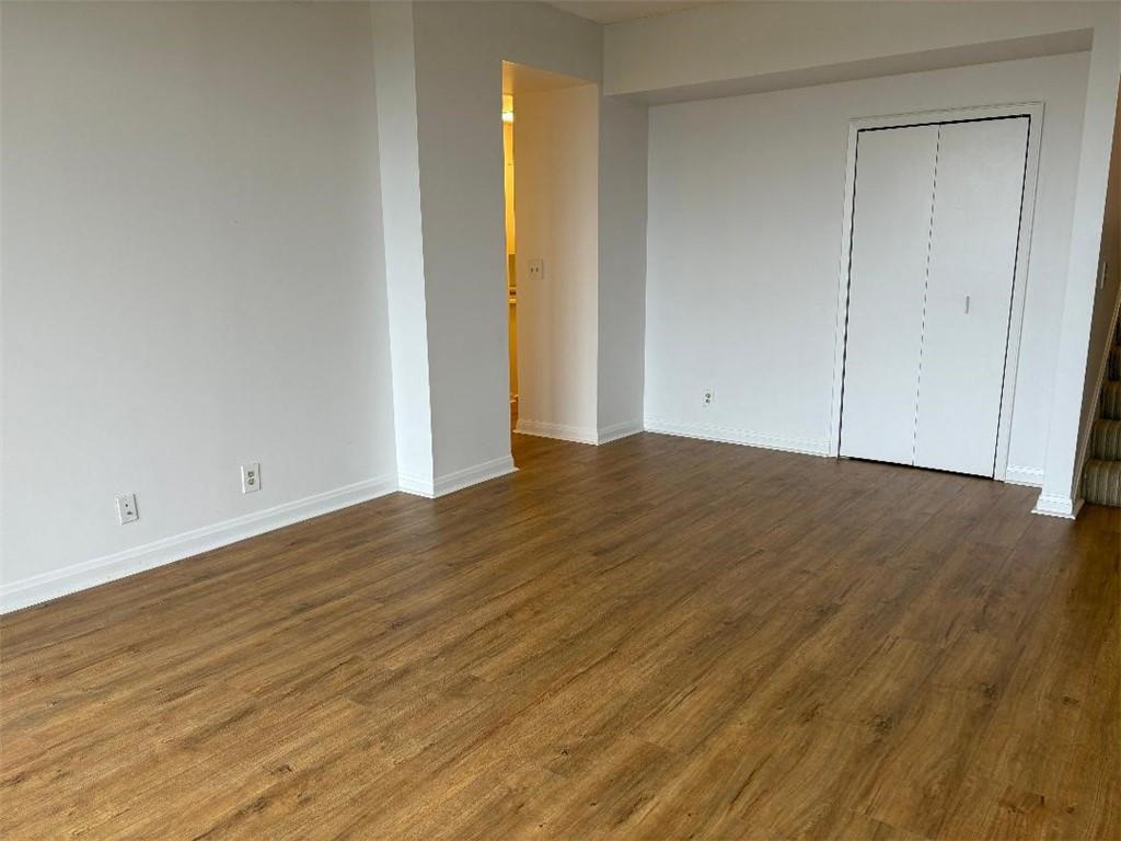 145 15th Street Northeast, Unit 1007 Atlanta, GA 30361 - Photo 5 of 14 a view of empty room with wooden floor