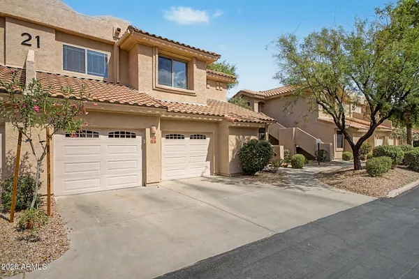 a front view of a house with a garage