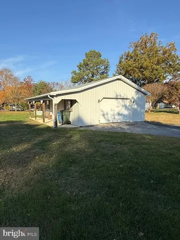 a view of a big yard with a house