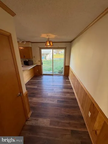 a view of entryway with wooden floor