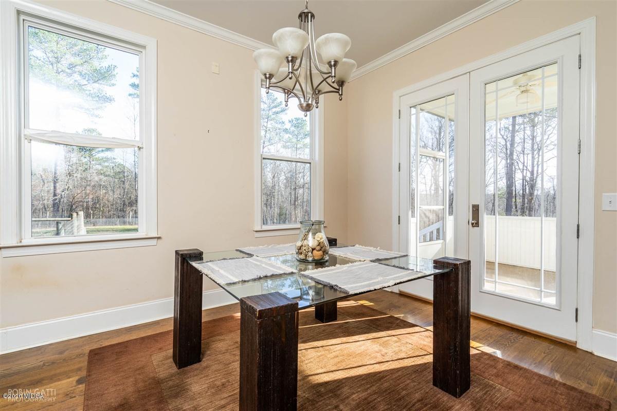 125 Raleigh Drive Forsyth, GA 31029 - Photo 5 of 37 a view of a dining room with furniture window and wooden floor