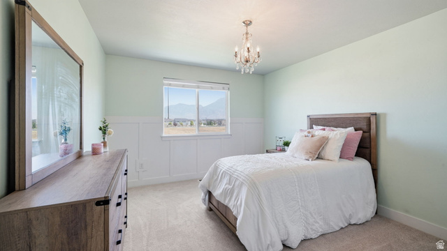111 East Silver Oak Road Vineyard, UT 84059 - Photo 32 of 50 Light-filled room featuring a chandelier light fixture, wood-finish flooring, and a large window
