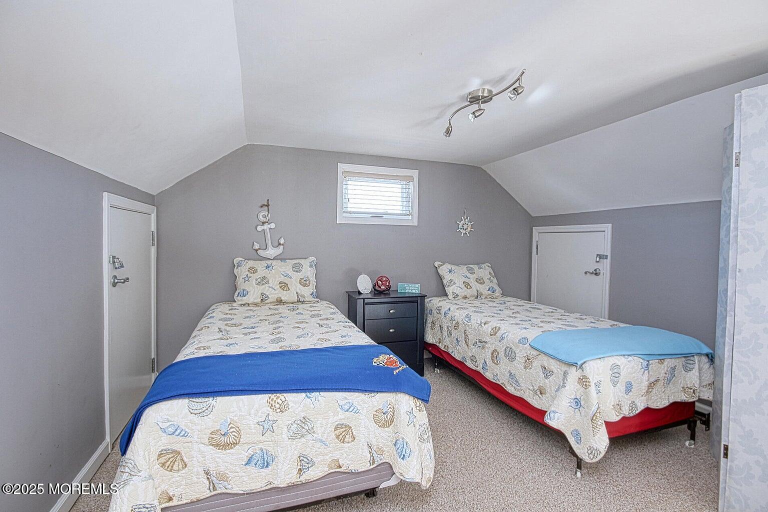 30 Stockton Avenue Seaside Park, NJ 08752 - Photo 11 of 16 a bedroom with a bed and a lamp