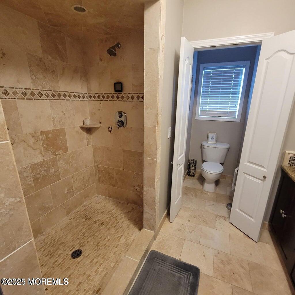 30 Stockton Avenue Seaside Park, NJ 08752 - Photo 13 of 16 a bathroom with a shower and a toilet
