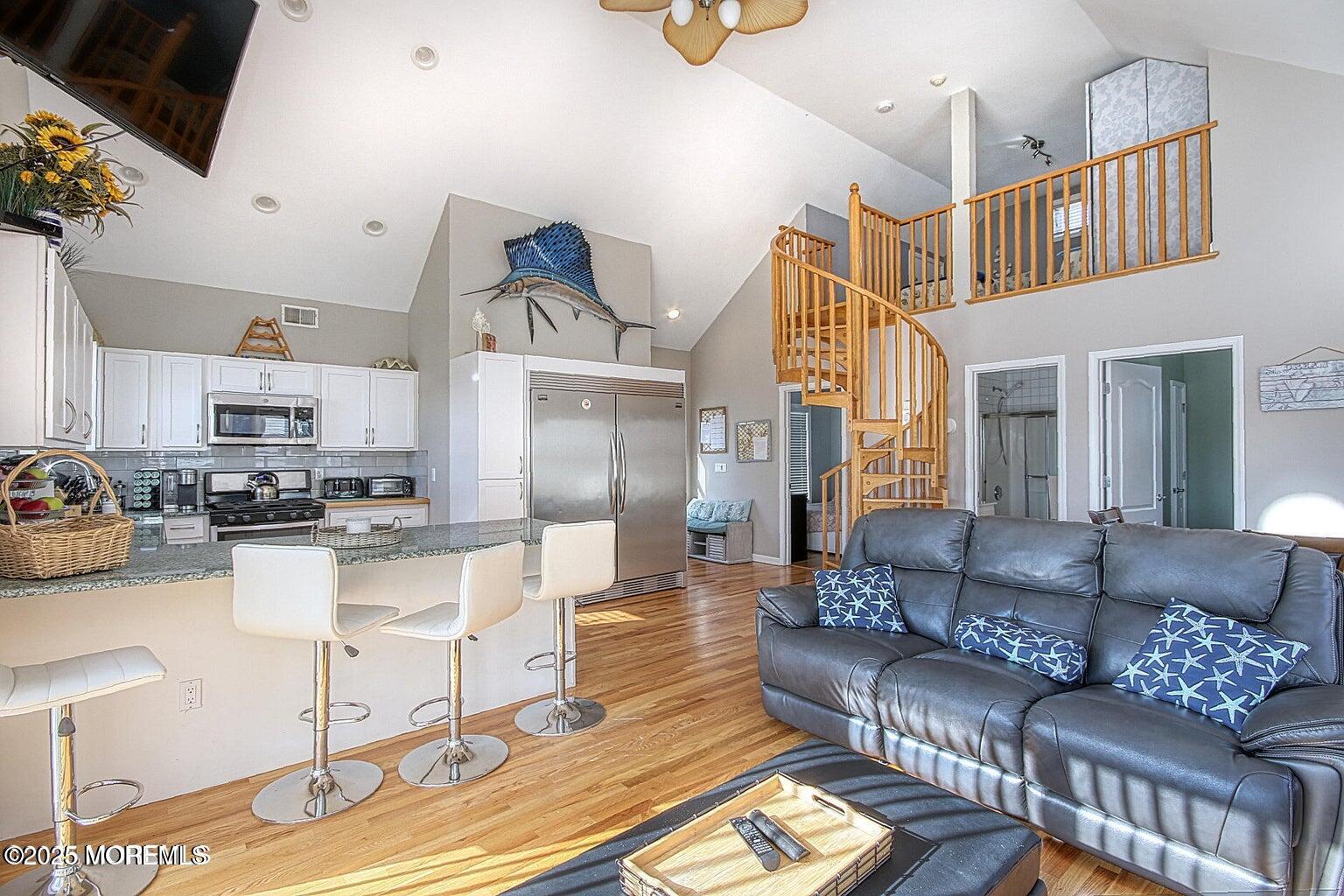 30 Stockton Avenue Seaside Park, NJ 08752 - Photo 2 of 16 a living room with furniture and a flat screen tv