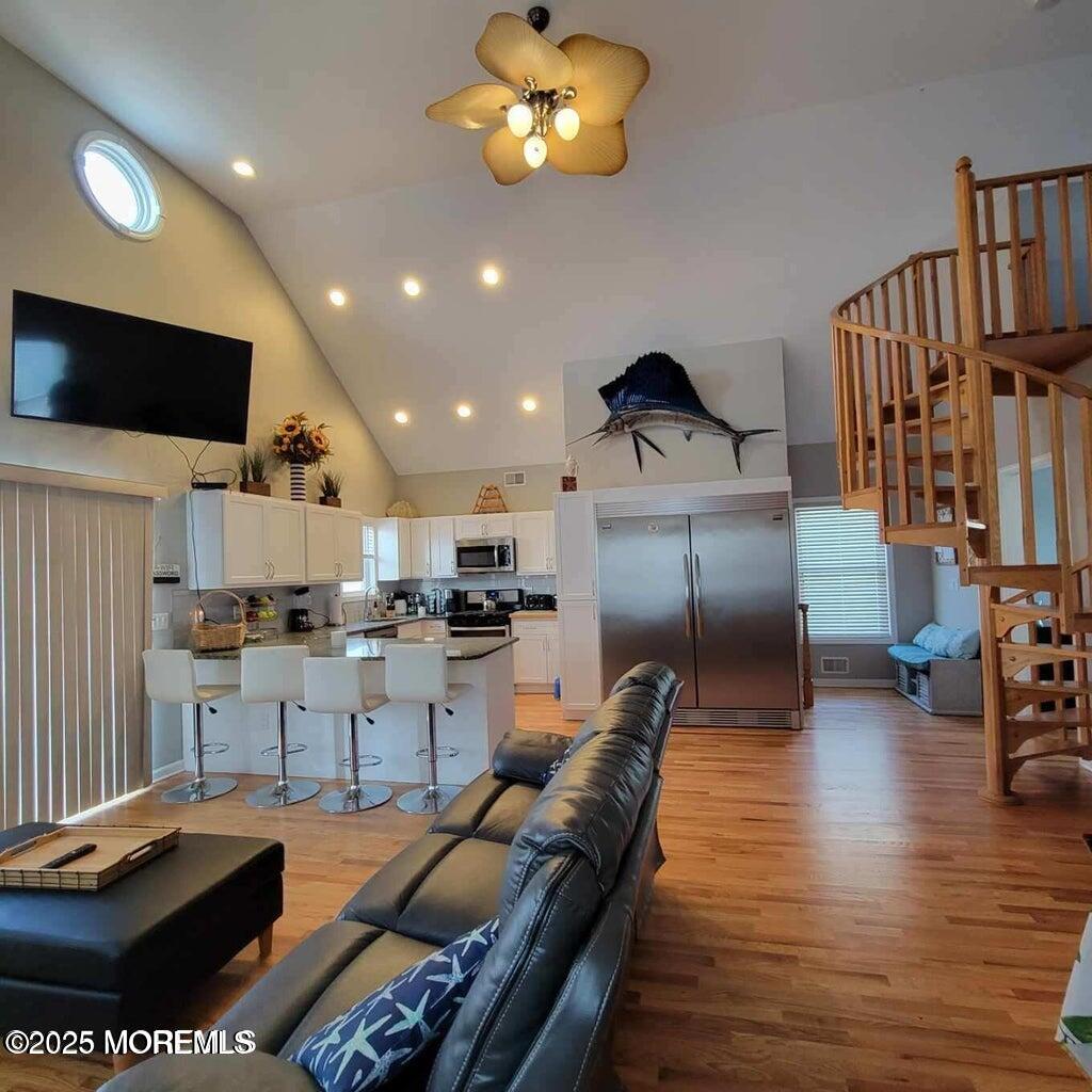 30 Stockton Avenue Seaside Park, NJ 08752 - Photo 3 of 16 a living room with lots of furniture and kitchen view