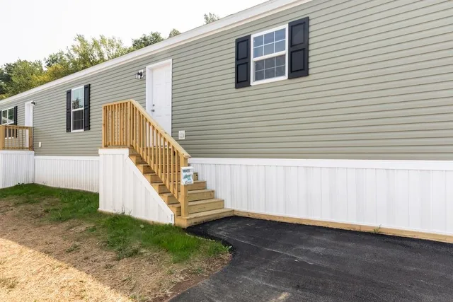 a view of a house with backyard and white door
