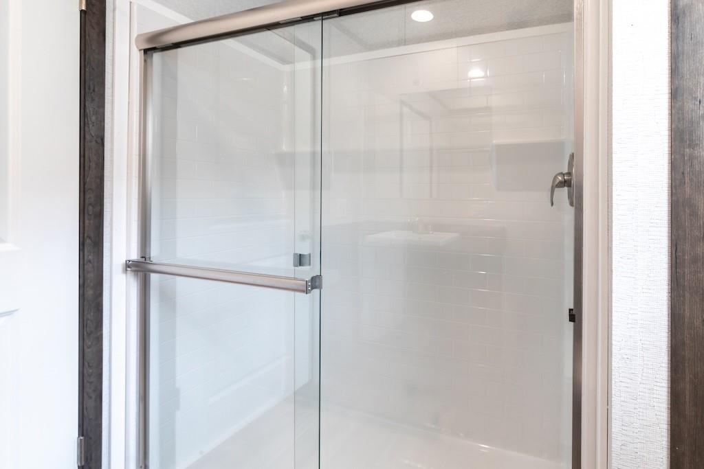 321 Beallsville Road Bentleyville, PA 15314 - Photo 11 of 21 a bathroom with a glass shower door