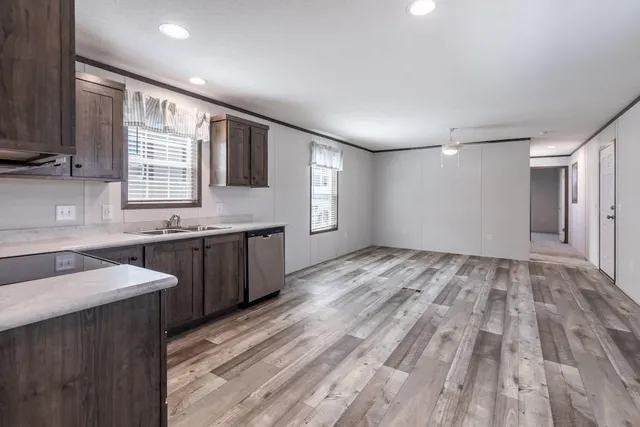 a view of a kitchen cabinets a sink and a window
