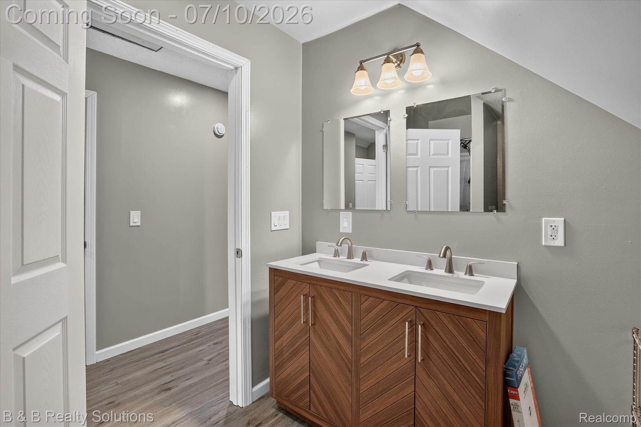 1564 East Burnside Road North Branch, MI 48461 - Photo 17 of 25 Dual vanity with white undermount sinks, brushed nickel fixtures, and a white countertop