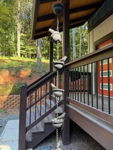 a view of a two chairs in the balcony
