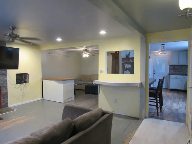 a large room with a couch and a view of living room