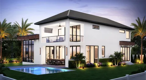 a front view of a house with a yard table and chairs