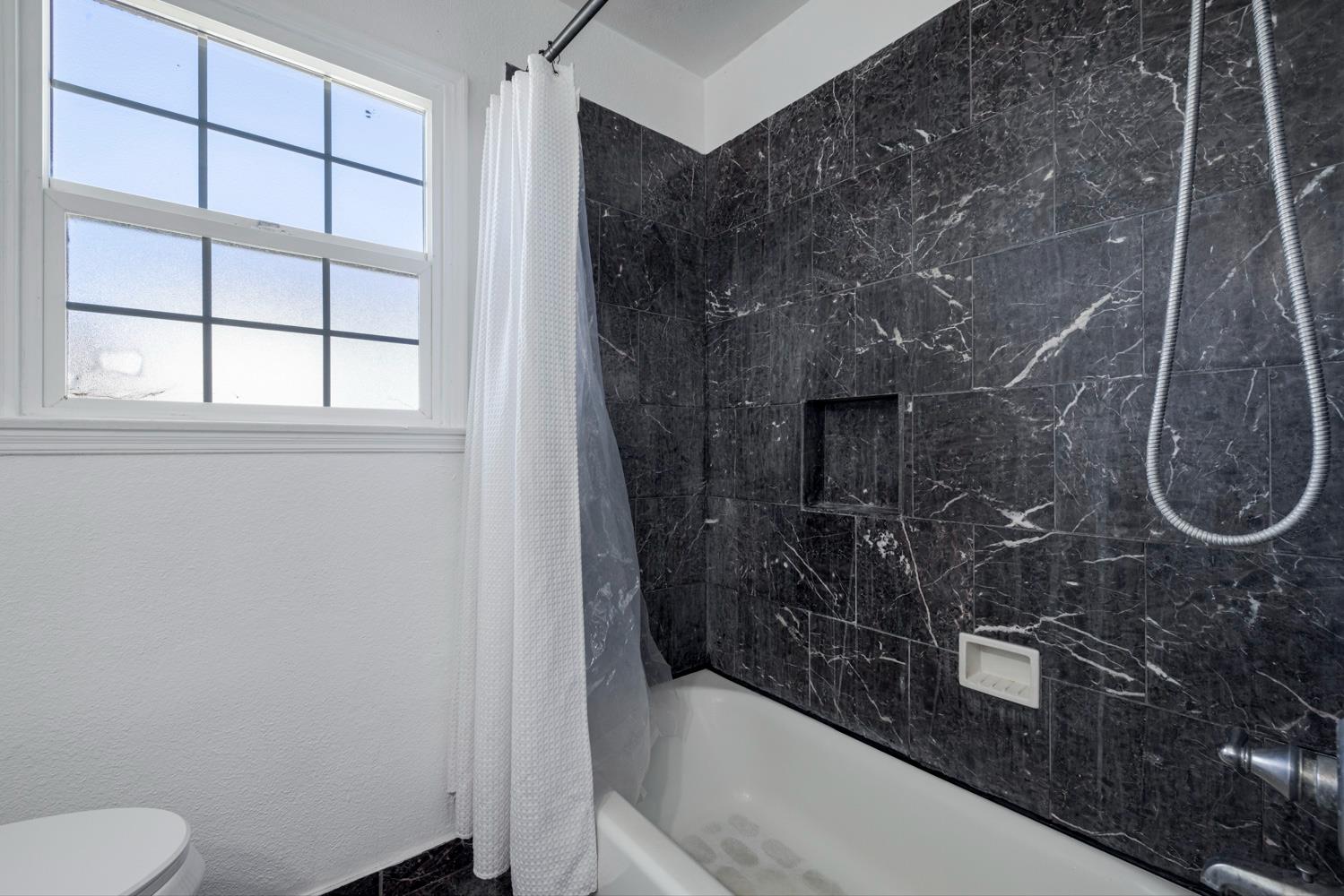 1030 Alpha Road Turlock, CA 95380 - Photo 16 of 25 a bathroom with a shower