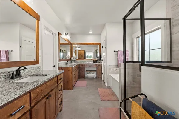 a bathroom with a tub and a shower