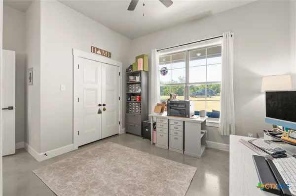 a bedroom with a bed and a table in it