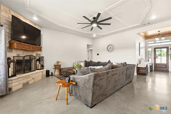 a kitchen with stainless steel appliances granite countertop a sink a stove and a refrigerator